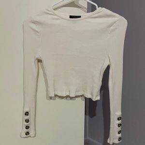 White tight fitting long sleeve crop top